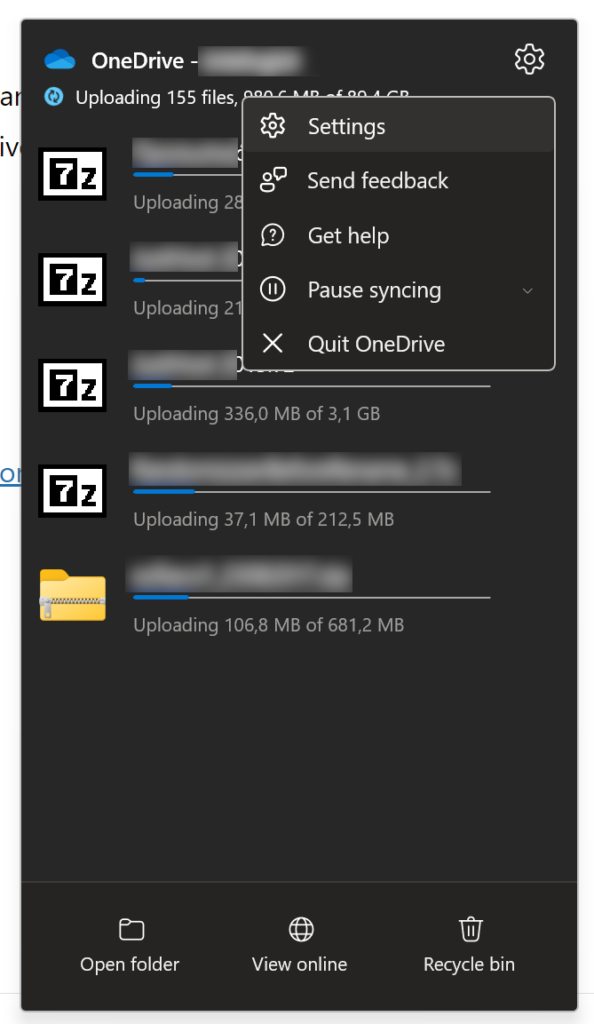 image of OneDrive for Business uploading 5 files concurrently. The Settings flyout menu is open and the Settings option is highlighted on the menu.